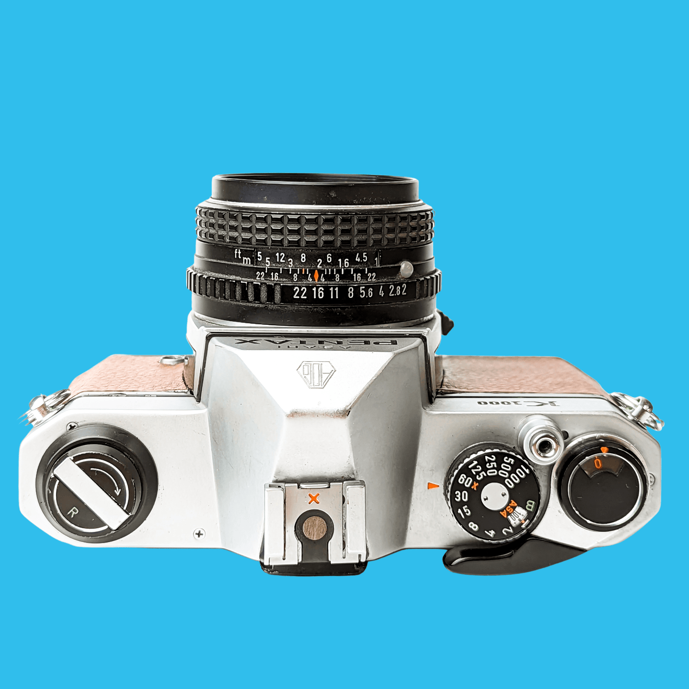 Pentax K1000 Brown Leather Vintage SLR 35mm Film Camera with Pentax f/2 50mm Prime Lens.