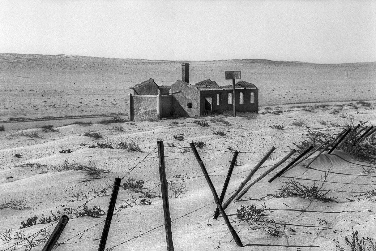 Pentax K1000 Brown Leather Vintage SLR 35mm Film Camera with Pentax f/2 50mm Prime Lens.