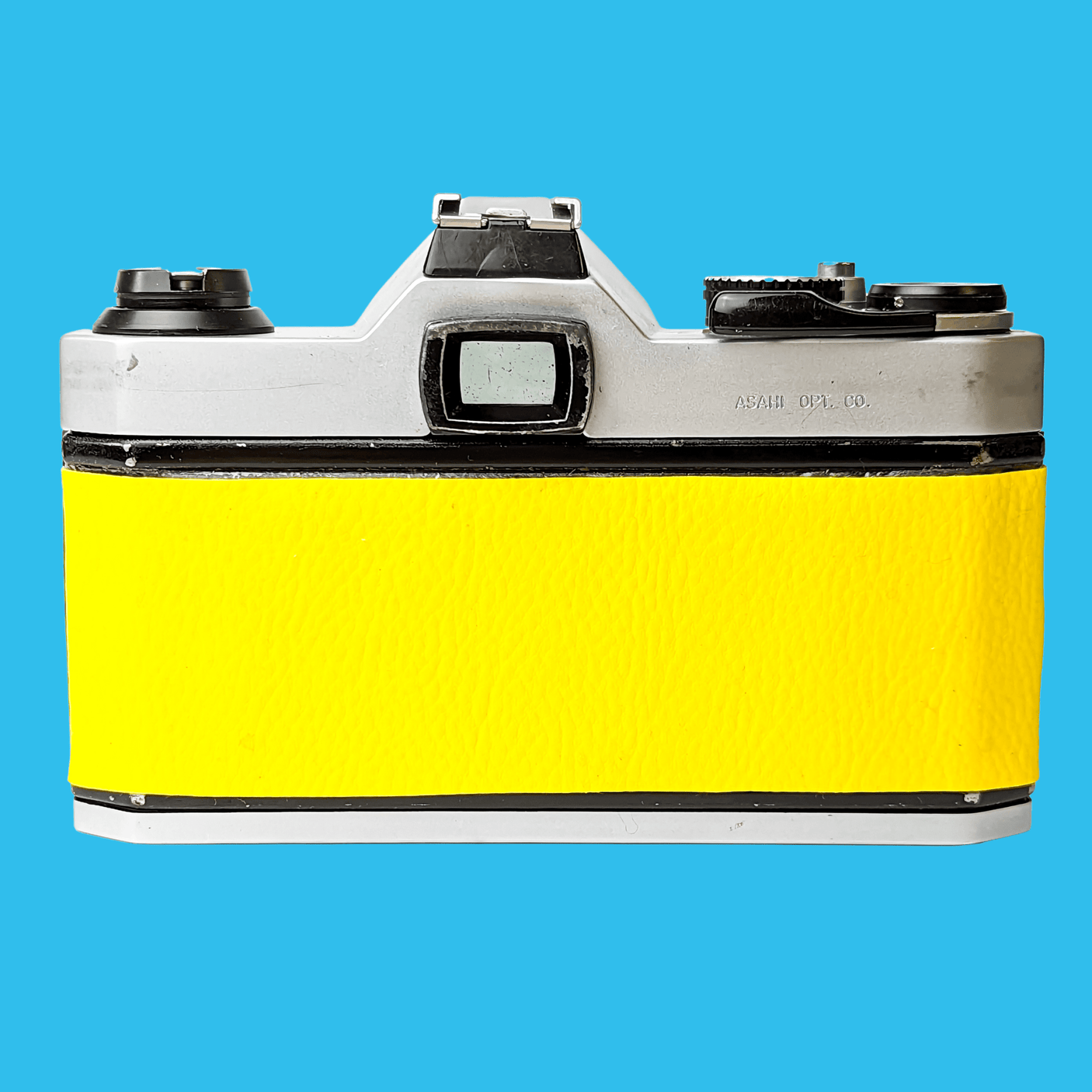 Pentax K1000 Yellow Leather Vintage SLR 35mm Film Camera with Pentax f/2 50mm Prime Lens.