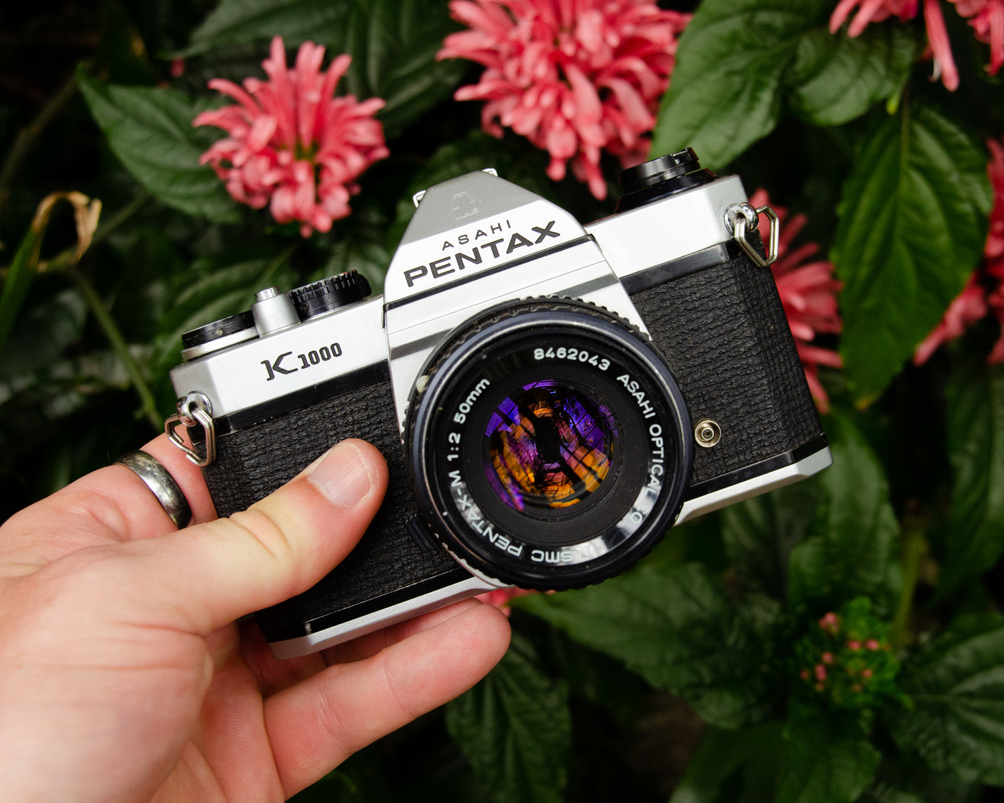 Pentax K1000 Vintage SLR 35mm Film Camera with Pentax f/2 50mm Prime Lens. Film camera store.
