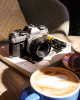 Canon AE-1 35mm SLR Film Camera with Canon Prime Lens - Film Camera Store.