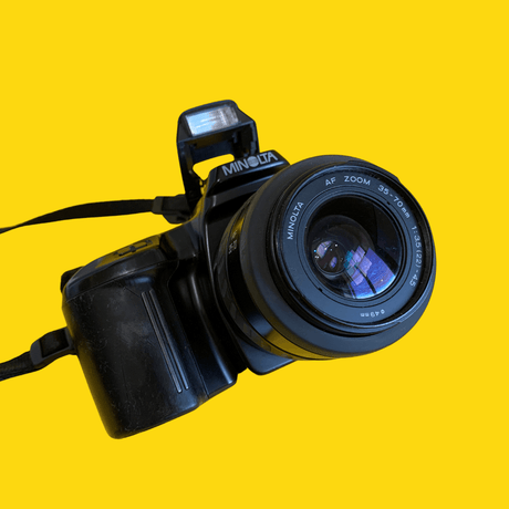 Minolta Maxxum 3xi Automatic 35mm SLR Film Camera with Auto Zoom Lens