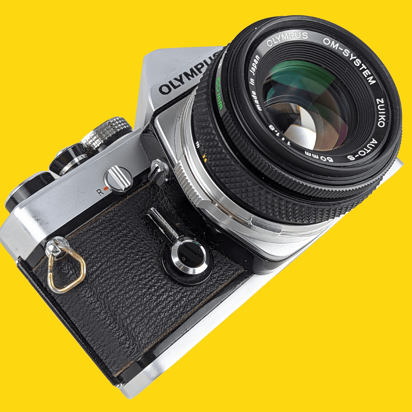 オリンパス OM 1 ビンテージ 35mm 一眼レフ フィルム カメラ、f/1.8 50mm プライム レンズ付き