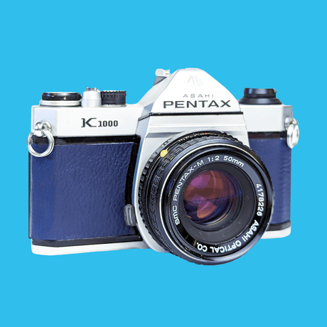 Pentax K1000 Navy Leather Vintage SLR 35mm Film Camera with Pentax f/2 50mm Prime Lens.