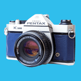 Pentax K1000 Navy Leather Vintage SLR 35mm Film Camera with Pentax f/2 50mm Prime Lens.