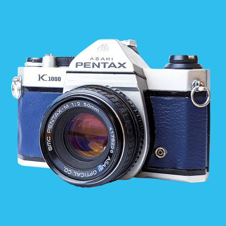 Pentax K1000 Navy Leather Vintage SLR 35mm Film Camera with Pentax f/2 50mm Prime Lens.