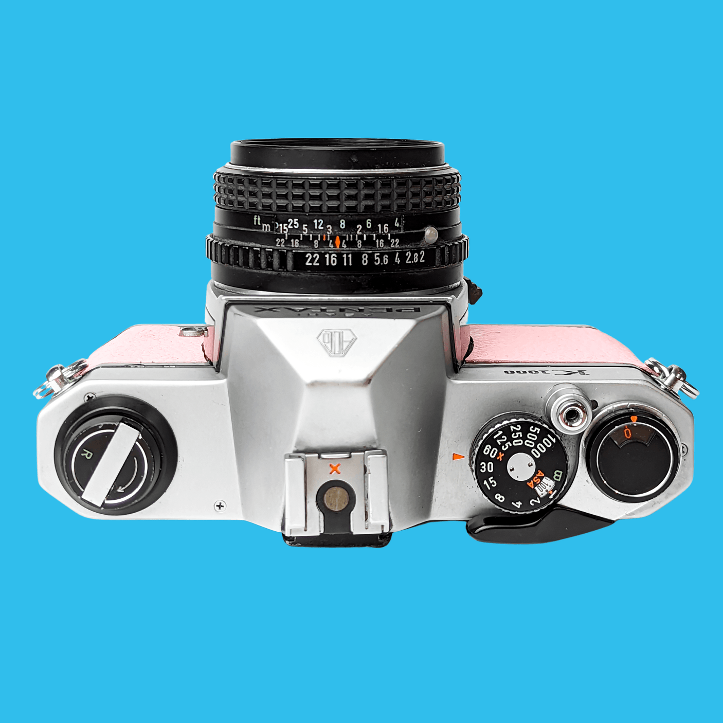 Pentax K1000 Pink Leather Vintage SLR 35mm Film Camera with Pentax f/2 50mm Prime Lens.